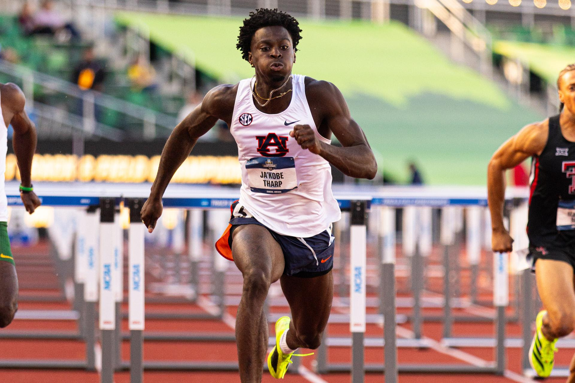 Tharp breaks world 110m hurdles record in Eugene